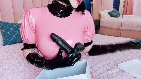 Naughty latex maid found a box with toys while cleaning