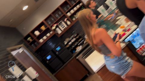 Blonde girl showing her cheeks in denim shorts